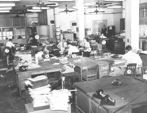 1600dpi An old-school newsroom, when reporters played pranks by switching the numbers on each other's desks.